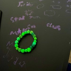 Green  bracelet 7$ listing price15$ made by 9 yr old kid